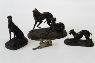 After Barrie, a cast bronze patinated spelter figure of a longdog, seated, with ears back, bears