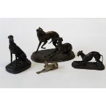 After Barrie, a cast bronze patinated spelter figure of a longdog, seated, with ears back, bears