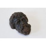 A 19th century cast iron Bacchus mask, probably an element of door furniture, 17cm