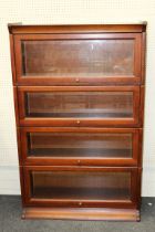 A late 20th century Globe Wernicke style mahogany stained four tier bookcase, each with rising