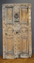 A large early 19th century pine panel door, having four fielded panels and a pair of roundel panels,