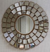 A large, late 20th century gilded wall mirror, with many square peripheral plates, around a