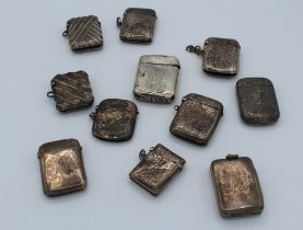 A collection of eleven late 19th / early 20th century silver vesta cases, each with hinged cover.