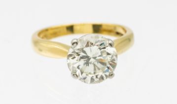 A diamond and 18ct gold solitaire ring, comprising a claw set round brilliant cut diamond weighing