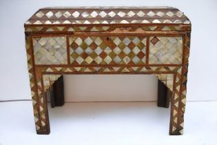 An 18th Century Ottoman (Turkish) inlaid red tortoiseshell and mother of pearl casket on raised