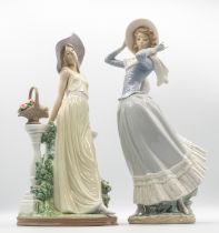 Lladro - a Daisa 1985 figure of a lady leaning on balcony with basket of flowers beside, approx.