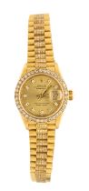 Rolex: a Ladies diamond set 18ct gold DateJust wristwatch, comprising a round signed gilt dial
