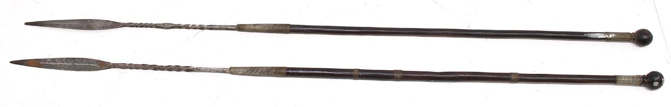 Two 20th century Southern African short spears or ‘Iklwa’. Polished lignum vitae shafts with ball