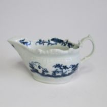 A Worcester sauce boat, relief moulded with a scroll handle, painted in blue with the 'Two Porter