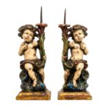 A pair of Continental giltwood, polychrome and metal candle holder / stands in the Baroque manner,