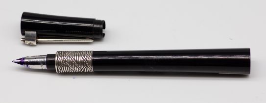 A Waterman Serenity fountain pen with arched and tapering black resin body, silver criss cross