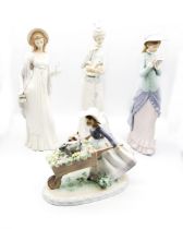 Lladro: three tall figures depicting ladies, one wearing hat and dress, one reading and the other