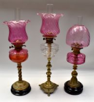 A small collection of three late 19th/early 20th century oil lamps, various designs to include;