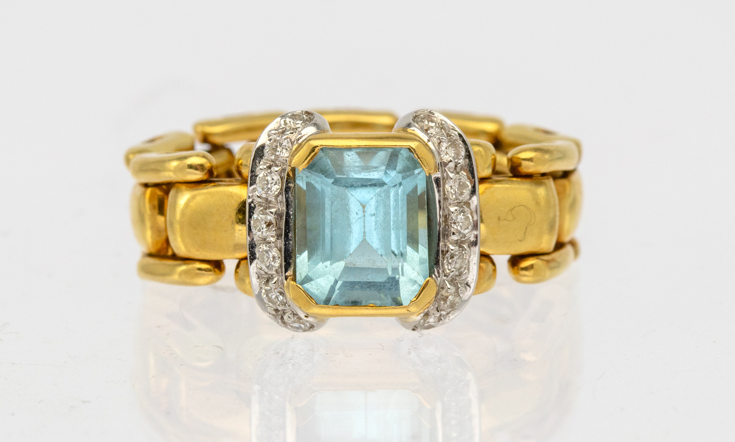 A blue topaz and diamond 18ct gold chain link ring, comprising an emerald cut blue topaz, rub over - Image 2 of 2
