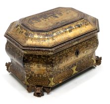 An early to mid 19th century Chinese lacquered wood tea caddy of casket shape with elaborate