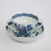 A Worcester twin handled Chocolate Cup and Stand, blue and white transfer printed with the 'Three