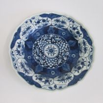 A Worcester plate, of lobed circular shape and painted in blue with the 'K'ang Hsi Lotus' pattern,