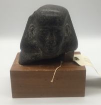 An ancient Egyptian, New Kingdom era (c.1550BC - 1069BC) granite head of a man, possibly a local