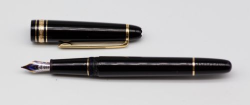 A Montblanc Meisterstruck 4810 black and gold fountain pen, the silver and yellow metal nib