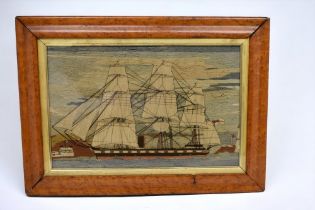 A 19th Century English probably Sailor's wool-work panel depicting a three mast Frigate within