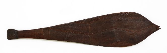 An Aboriginal wood spear thrower called a Woomera, probably Western Australian and 19th century,