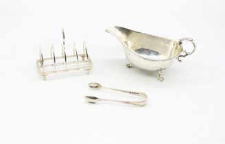 A late Victorian silver five Gothic arch toast rack, hallmarked by Thomas Bradbury & Sons,