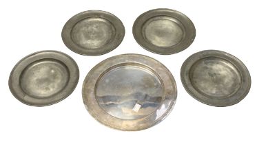 Four 18th Century pewter paten / small plates, touch marks to base, approx 21.5cm diam together with