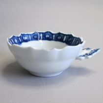 A Derby blue and white wine taster/tastevin with ogee shaped bowl and lobed rim, painted with an