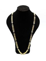 An enamel and 18ct gold necklace, comprising a three row fancy link chain with rectangular bar