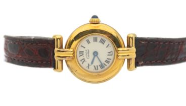 Cartier: a ladies Colisee vermeil Must de Cartier quartz wristwatch, comprising a round cream signed