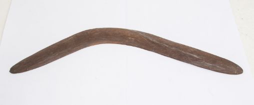 An Aboriginal boomerang, probably 19th century, simple but slight ribbed design, approx. 52cm long.