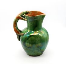 An early 20th century 'Lizard' jug by E B Fishley, Fremington, North Devon, with green glazed