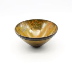 Andrew Hill raku fired conical bowl shades of brown and orange over black body. Diameter approx