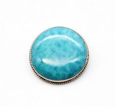 Charles Horner - a George V silver mounted Ruskin Pottery circular brooch, of mottled turquoise