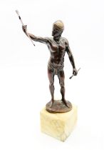 After Alfred Moret (1853-1913) - a patinated bronze figure of a standing knight, holding scabbard in