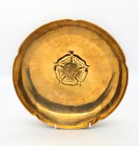 Keswick School of Industrial Arts - an Arts & Crafts style planished brass bowl, of floral shape