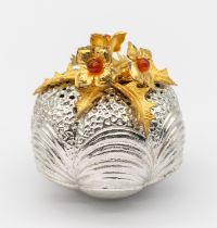 Christopher Nigel Lawrence - a textured silver globular shaped pomander, with gilt leaf and flower