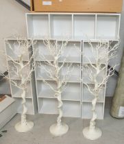 Seven Wall display units plus three white decorative trees.