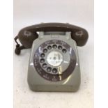 A vintage telephone (706L, G.P.D., F.D.J., BATCH SAMPLED FWR 68/2A)