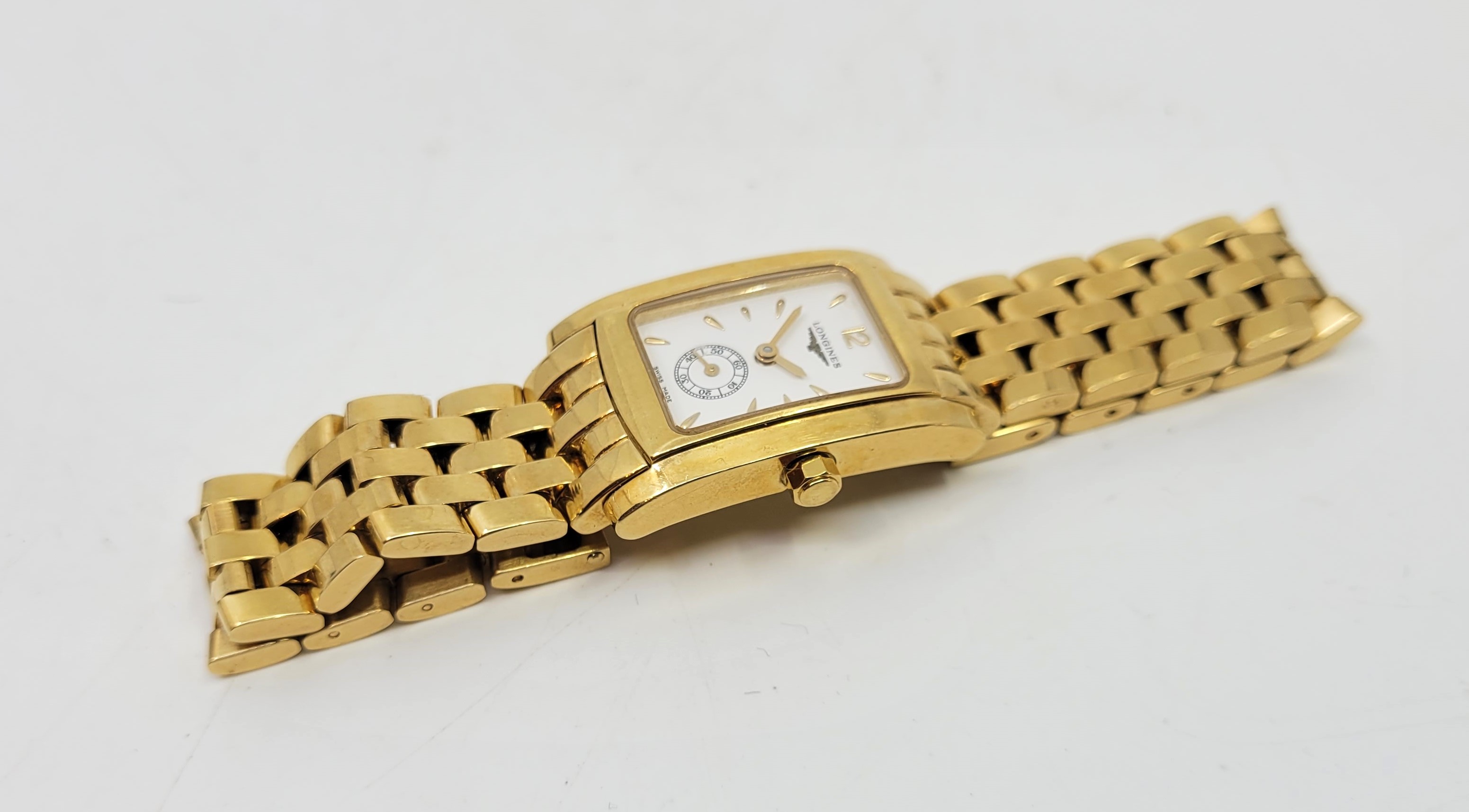 An 18ct. gold Longines DolceVita model L5.155.6 quartz bracelet watch, having signed white