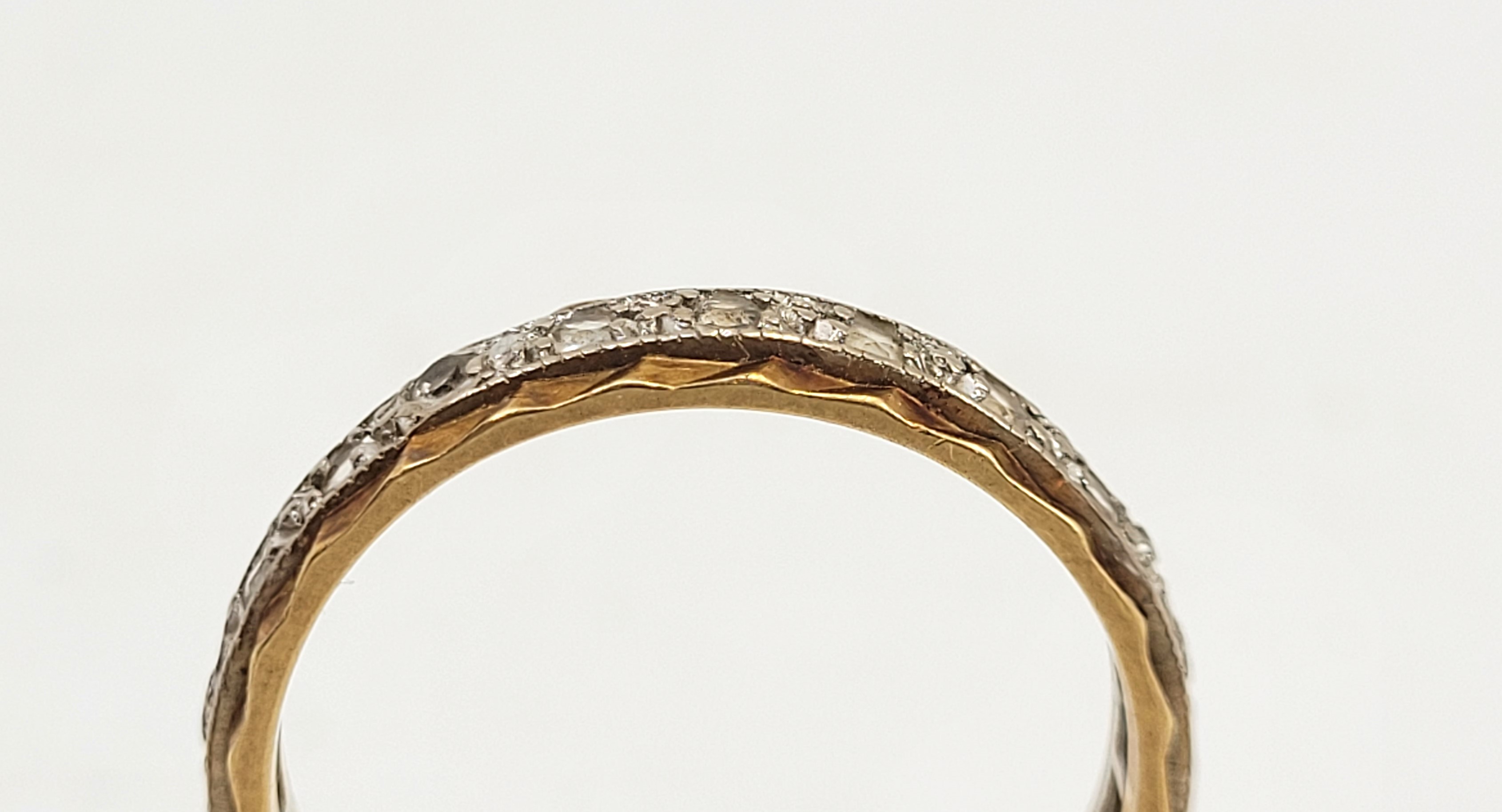 An 18ct. bi-colour gold and diamond eternity ring, set numerous round brilliant cut diamonds, size - Image 6 of 6