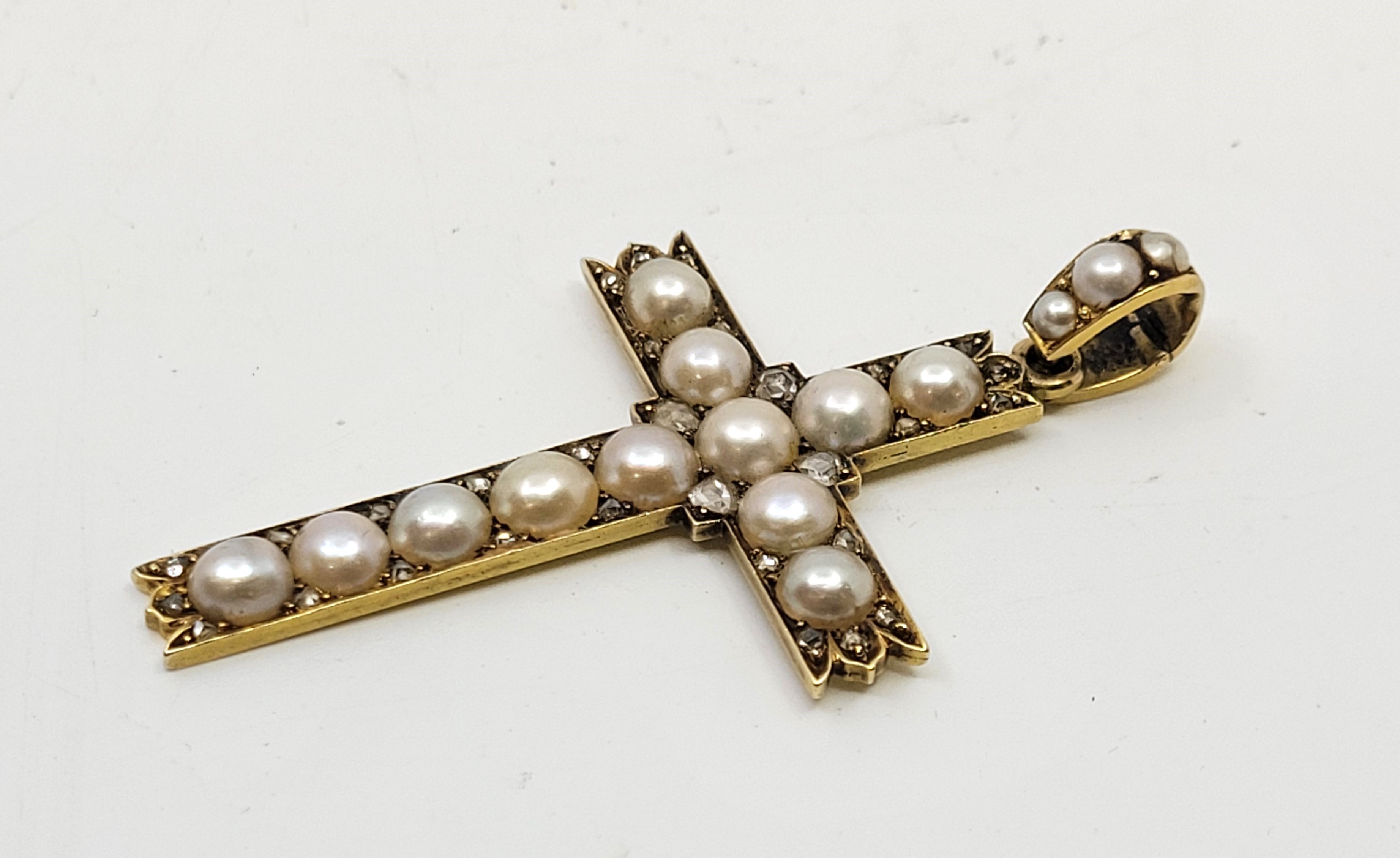 A precious yellow metal, diamond and cultured pearl cross, set rows of cultured pearls with pairs of