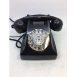 A vintage G.E.D. black bell telephone.