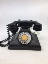 A vintage black SIEMENS BROTHERS & CO bell telephone