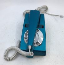 A vintage blue Trim telephone