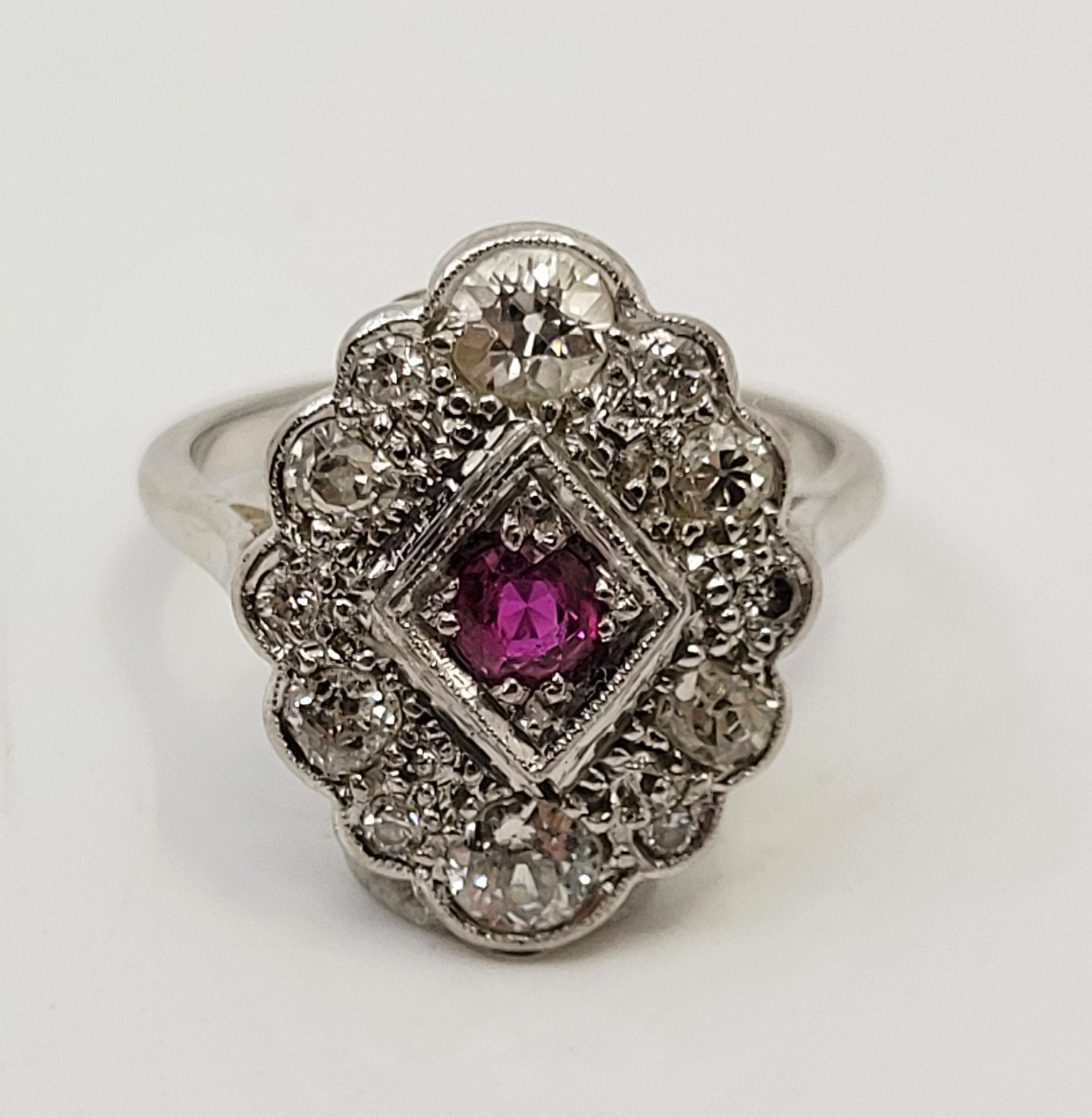 An 18ct. white gold, diamond and ruby ring, in the Art Deco style, having lobed oval mount set mixed - Image 6 of 12