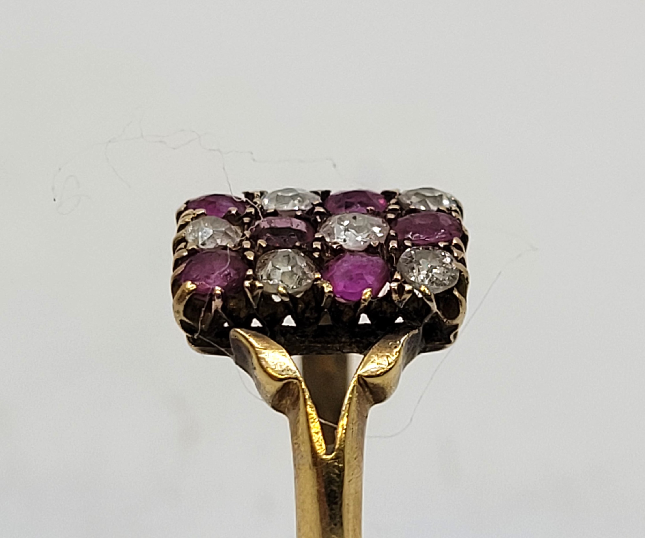 A yellow gold, ruby and diamond ring, having rectangular head set chequered pattern of six rubies - Image 2 of 9