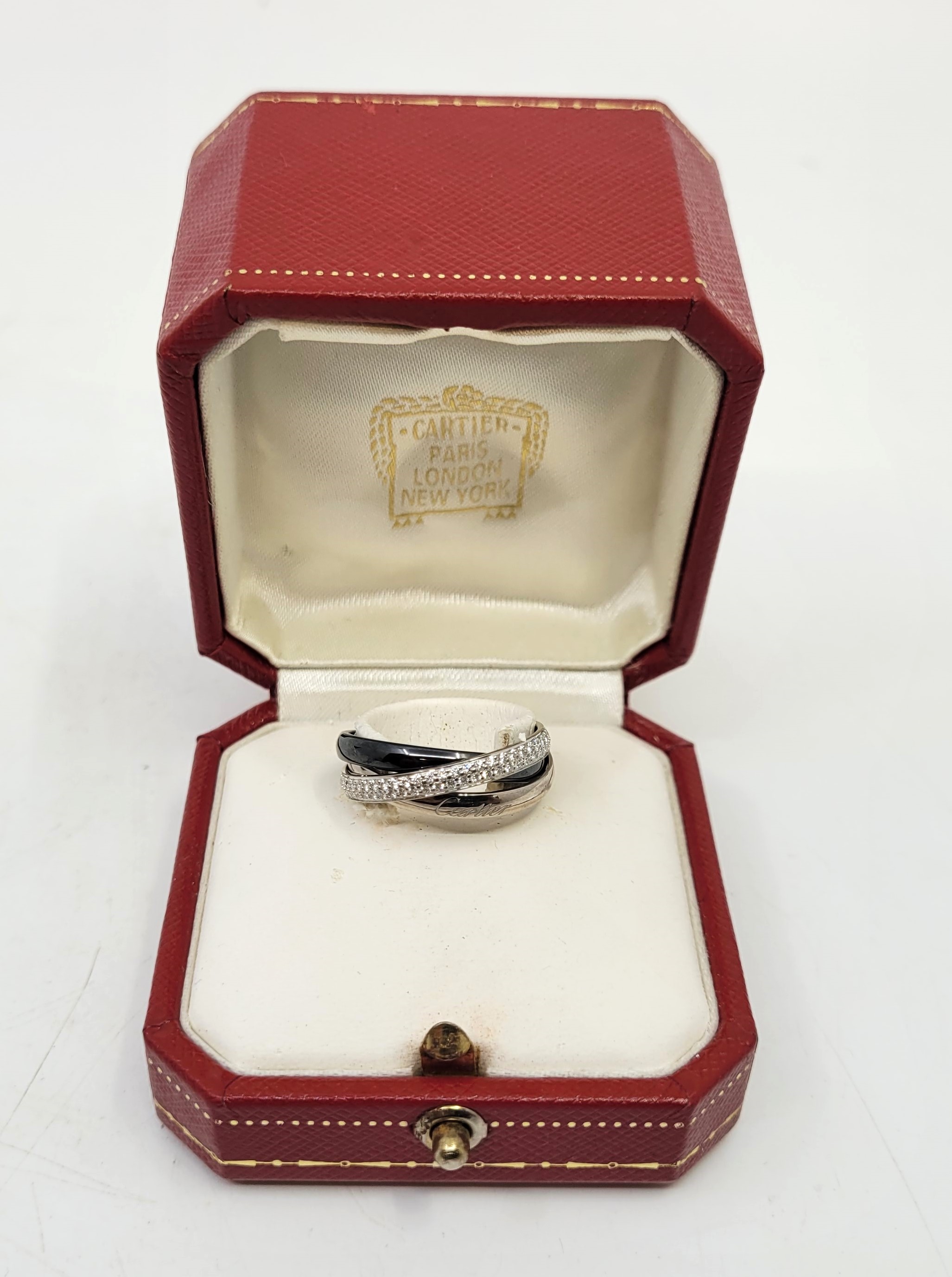 A Cartier 18ct. white gold, black ceramic and 18ct. white gold diamond set trinity ring, the plain - Image 15 of 21