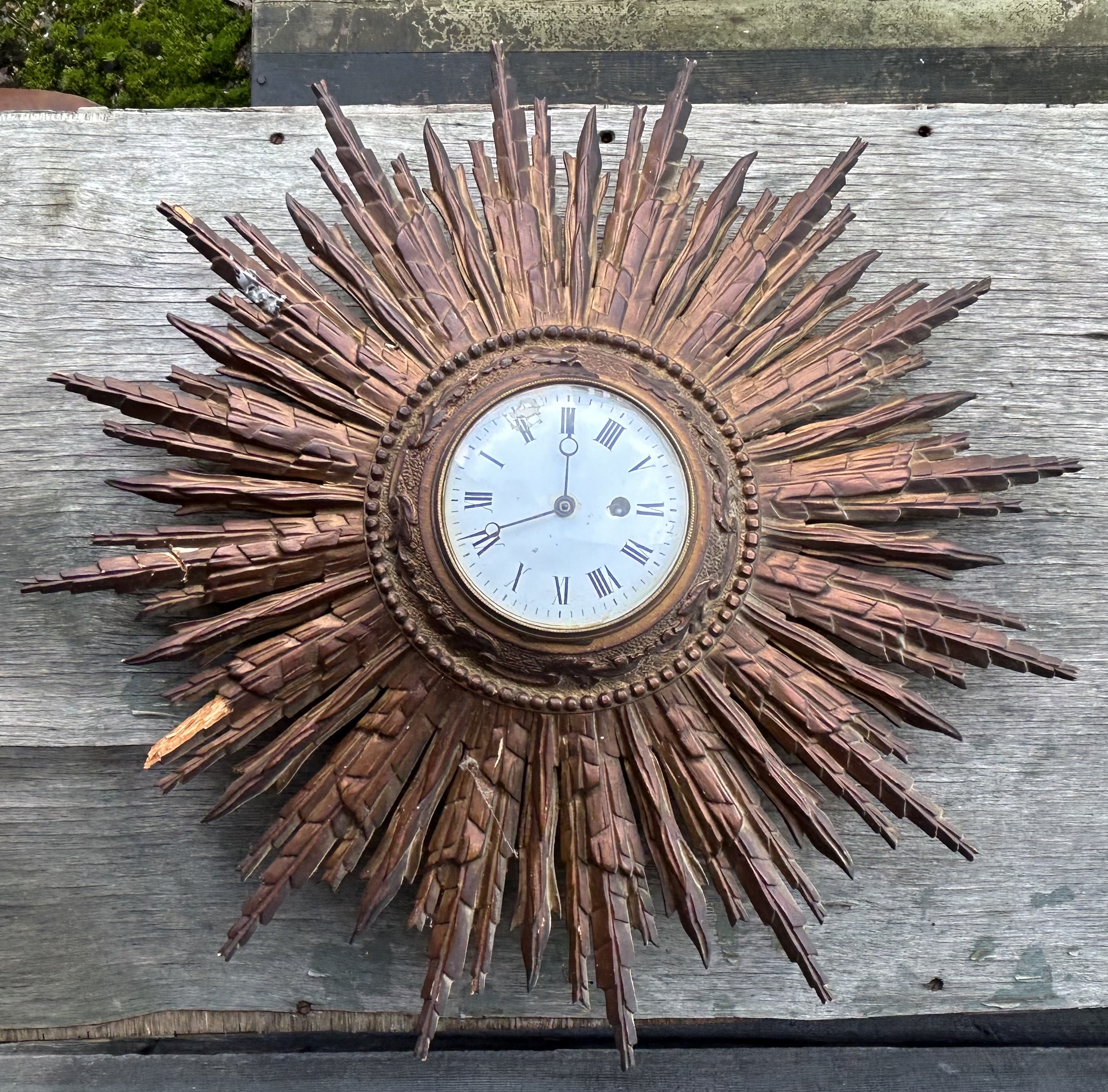 An early 20th century Sunburst French clock  , table and similar furniture faults