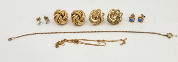 Two pairs of 9ct. gold earrings, one of tied knot form, the other of interlocking hoops, both